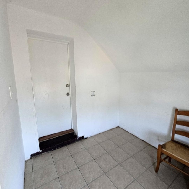 2322 S Trumbull Ave, Chicago, IL 60623 - additional living space featuring vaulted ceiling and light tile patterned flooring
