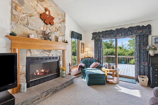 5057 Kasch Rd, Pecatonica, IL 61063 - carpeted living room with lofted ceiling and a fireplace