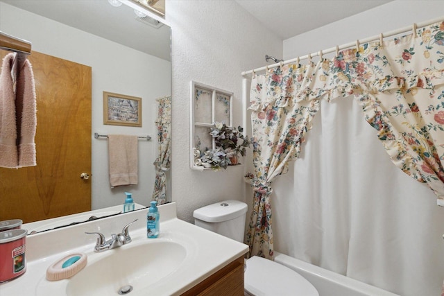 5057 Kasch Rd, Pecatonica, IL 61063 - bathroom featuring toilet, vanity, shower / bathtub combination with curtain, and a textured wall