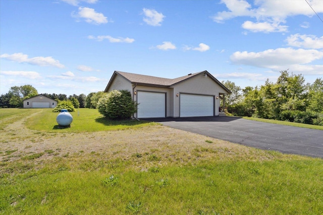 5057 Kasch Rd, Pecatonica, IL 61063 - view of front of home featuring a front yard, an attached garage, and driveway