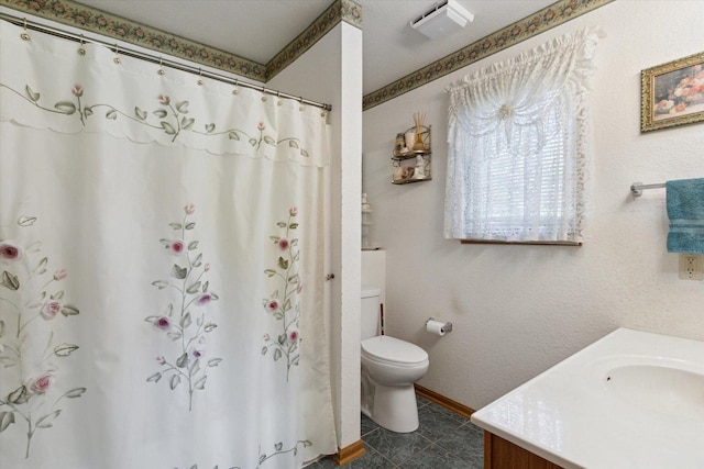 5057 Kasch Rd, Pecatonica, IL 61063 - full bath featuring toilet, vanity, a shower with curtain, and baseboards
