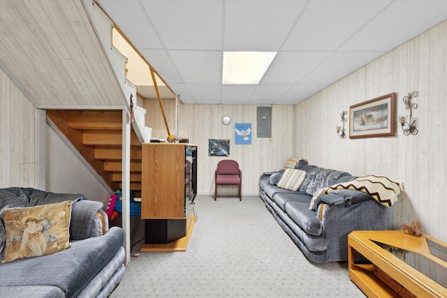 5057 Kasch Rd, Pecatonica, IL 61063 - living area with electric panel, carpet floors, stairs, a paneled ceiling, and wooden walls