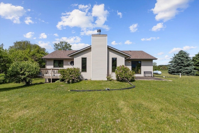 5057 Kasch Rd, Pecatonica, IL 61063 - back of property featuring a yard, a chimney, a deck, and a patio