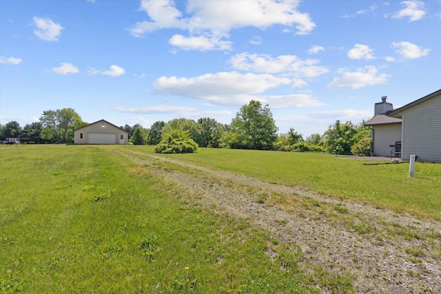 5057 Kasch Rd, Pecatonica, IL 61063 - view of grassy yard featuring a garage and a rural view