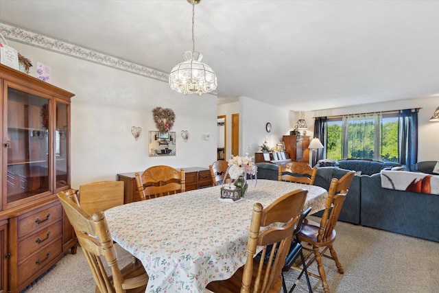5057 Kasch Rd, Pecatonica, IL 61063 - dining space with a chandelier and light colored carpet