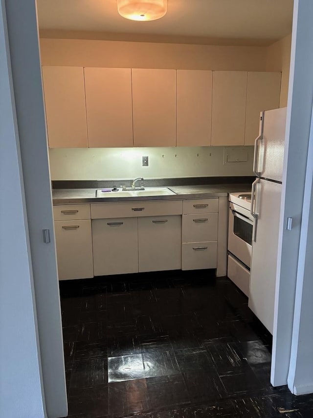 900 N Lake Shore Dr Unit 708, Chicago, IL 60611 - kitchen featuring a sink, white appliances, and white cabinetry