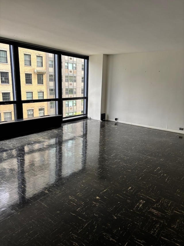 900 N Lake Shore Dr Unit 708, Chicago, IL 60611 - spare room featuring expansive windows and baseboards