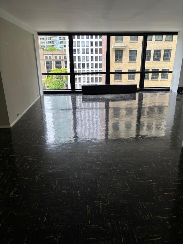 900 N Lake Shore Dr Unit 708, Chicago, IL 60611 - unfurnished room featuring baseboards and expansive windows