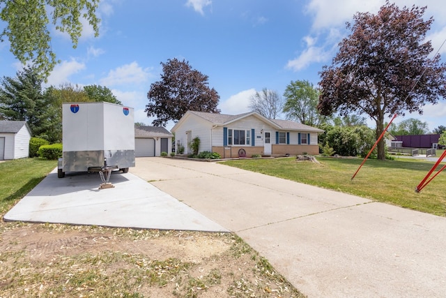 2383 Prairie Ave, Beloit, WI 53511 - single story home featuring an outdoor structure, a front lawn, and a garage