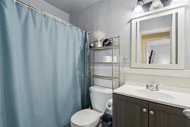2383 Prairie Ave, Beloit, WI 53511 - full bath featuring toilet, vanity, a textured wall, and curtained shower
