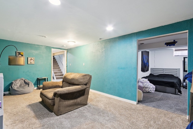 2383 Prairie Ave, Beloit, WI 53511 - carpeted living area with a textured wall and stairs