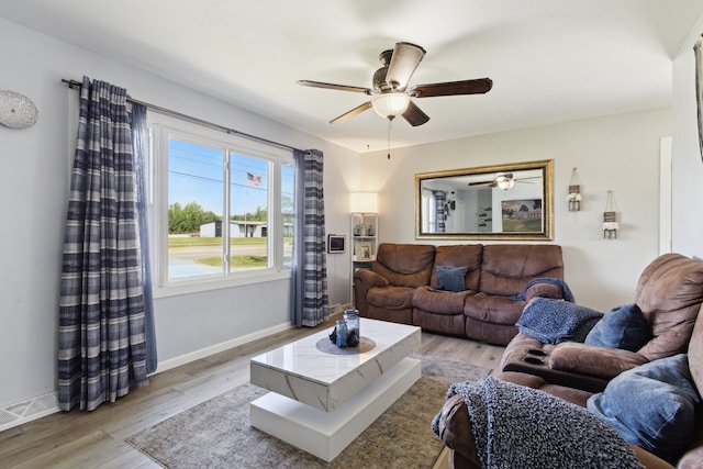 2383 Prairie Ave, Beloit, WI 53511 - living area featuring a ceiling fan, light wood finished floors, and baseboards