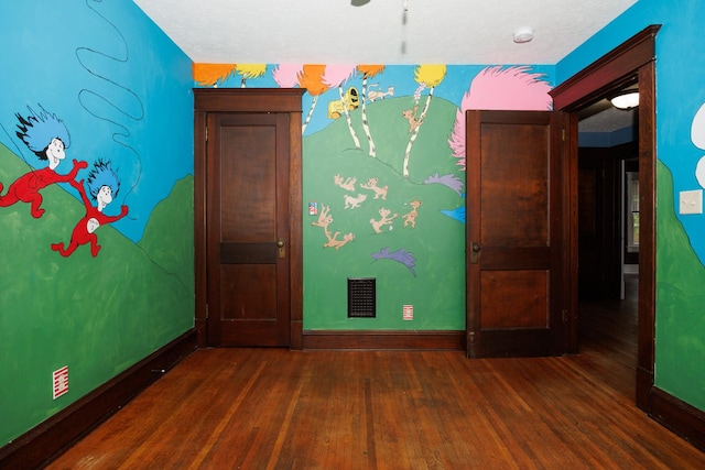1313 S Madison St, Bloomington, IL 61701 - unfurnished room with wood finished floors, baseboards, and a smoke detector