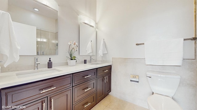 2330 W Armitage Ave Unit B, Chicago, IL 60647 - bathroom featuring double vanity, toilet, tile patterned floors, and a shower