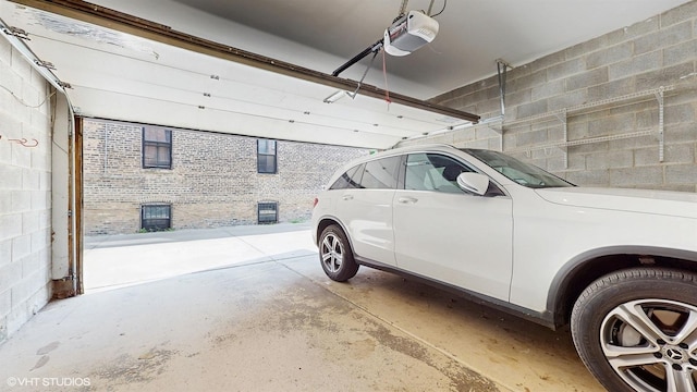 2330 W Armitage Ave Unit B, Chicago, IL 60647 - garage with a garage door opener and concrete block wall