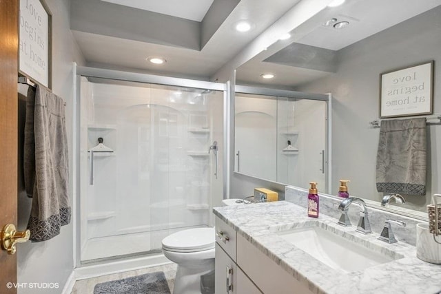 1302 Moraine Dr, Woodstock, IL 60098 - bathroom with vanity, a stall shower, toilet, and recessed lighting