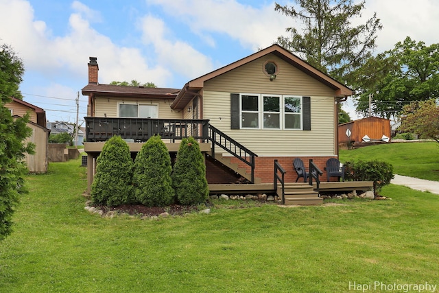 24991 W Forest Dr, Lake Villa, IL 60046 - back of property with a deck, a chimney, a yard, and stairs
