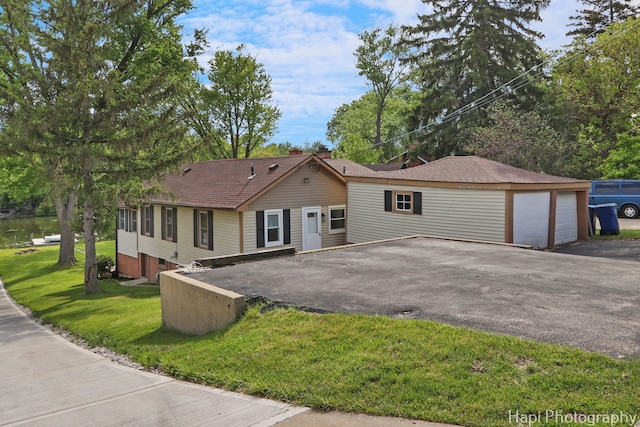 24991 W Forest Dr, Lake Villa, IL 60046 - ranch-style home with a front lawn, driveway, and a garage