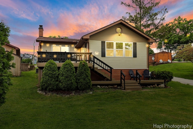 24991 W Forest Dr, Lake Villa, IL 60046 - rear view of house with a deck, stairs, a yard, and a chimney