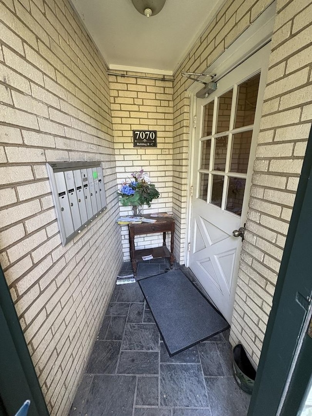 7070 N Ridge Blvd Unit 1B, Chicago, IL 60645 - entrance to property with brick siding