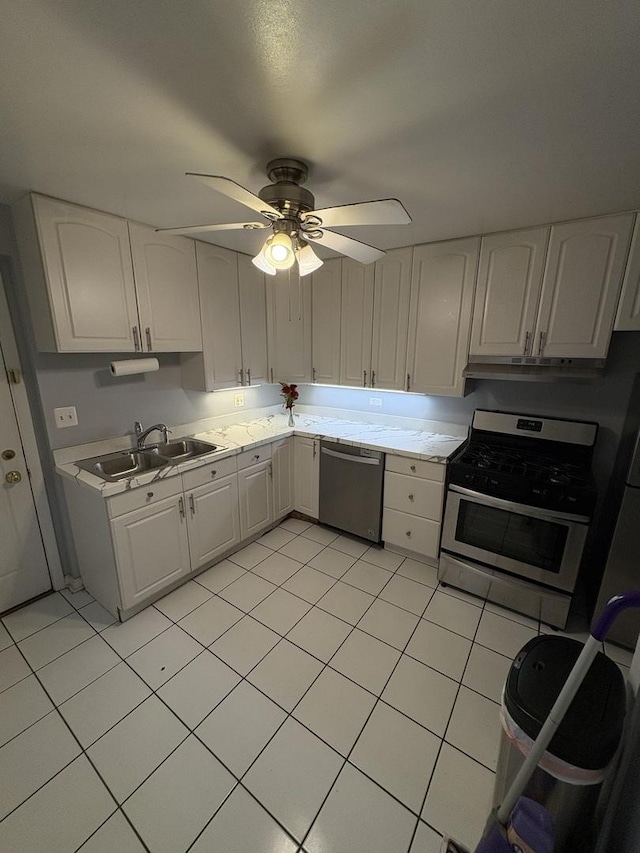 7070 N Ridge Blvd Unit 1B, Chicago, IL 60645 - kitchen with appliances with stainless steel finishes, light countertops, and light tile patterned floors