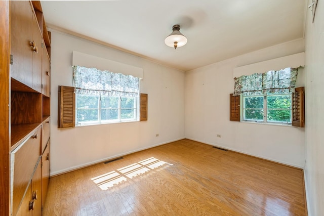 4N051 Wood Dale Rd, Addison, IL 60101 - unfurnished room with light wood finished floors and baseboards