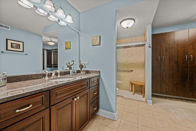 1103 N Mill St Unit 111, Naperville, IL 60563 - full bath featuring vanity, a stall shower, tile patterned floors, and baseboards