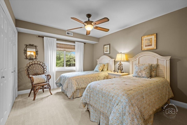 1103 N Mill St Unit 111, Naperville, IL 60563 - bedroom featuring baseboards, carpet flooring, a closet, and ceiling fan