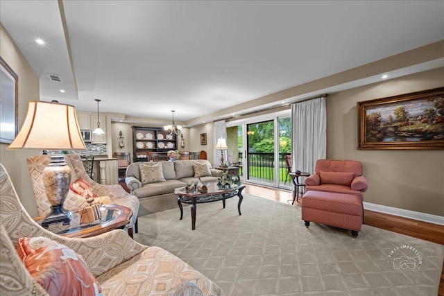 1103 N Mill St Unit 111, Naperville, IL 60563 - living room with light wood finished floors, baseboards, a chandelier, and recessed lighting