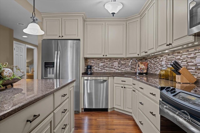 1103 N Mill St Unit 111, Naperville, IL 60563 - kitchen with appliances with stainless steel finishes, a sink, backsplash, and dark wood-style flooring