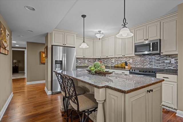 1103 N Mill St Unit 111, Naperville, IL 60563 - kitchen with appliances with stainless steel finishes, baseboards, backsplash, dark wood-style flooring, and recessed lighting