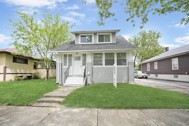 8 Manor Ct, Joliet, IL 60436 - bungalow-style house featuring a front lawn and a shingled roof