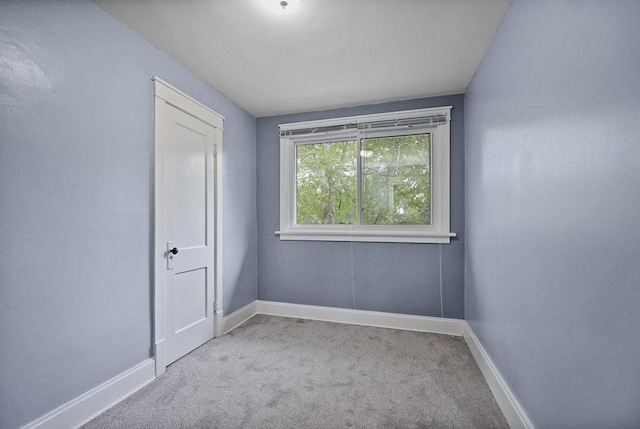 8 Manor Ct, Joliet, IL 60436 - empty room with carpet floors and baseboards