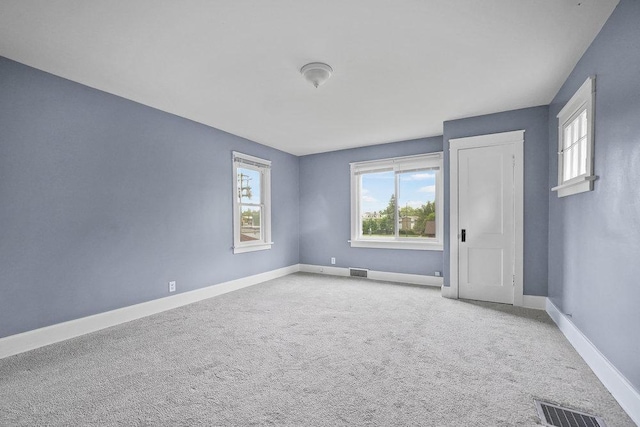 8 Manor Ct, Joliet, IL 60436 - spare room featuring baseboards and carpet flooring