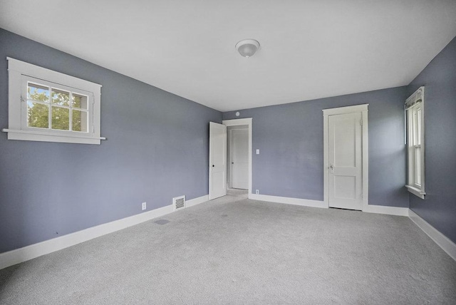 8 Manor Ct, Joliet, IL 60436 - unfurnished bedroom featuring baseboards and carpet flooring