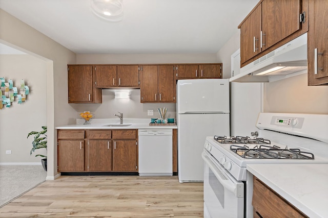 218 Deerpath Ct Unit B2, Schaumburg, IL 60193 - kitchen featuring white appliances, under cabinet range hood, a sink, and light countertops