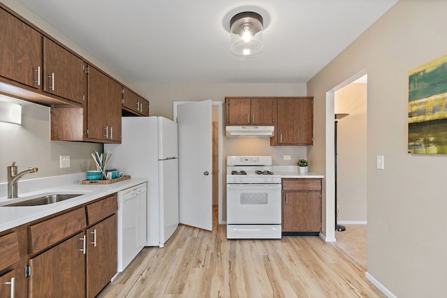 218 Deerpath Ct Unit B2, Schaumburg, IL 60193 - kitchen featuring white appliances, under cabinet range hood, a sink, and light wood finished floors