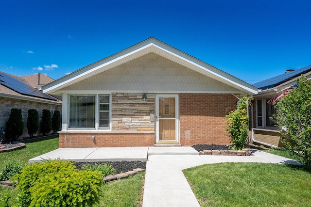 5708 W 82nd Pl, Burbank, IL 60459 - view of front of property with brick siding, a front lawn, and a patio area