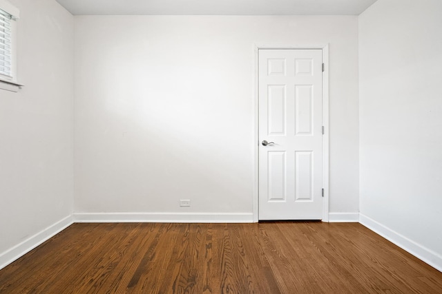 5708 W 82nd Pl, Burbank, IL 60459 - empty room featuring baseboards and dark wood-type flooring
