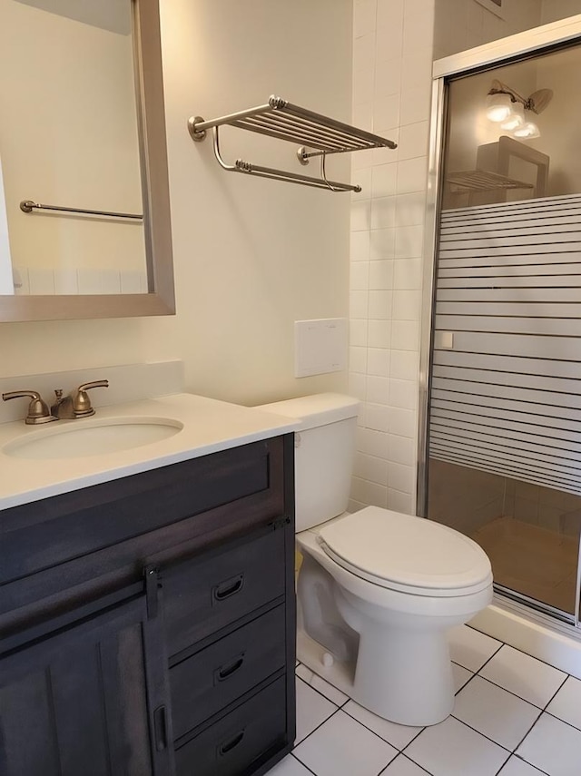 8815 W Golf Rd Unit 6B, Niles, IL 60714 - full bathroom featuring vanity, a shower stall, toilet, and tile patterned floors