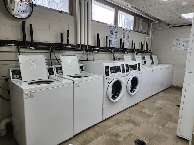 8815 W Golf Rd Unit 6B, Niles, IL 60714 - communal laundry room with washer and dryer and concrete block wall