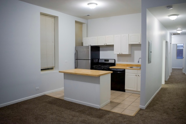 752 E 43rd St Unit 2E, Chicago, IL 60653 - kitchen with freestanding refrigerator, dishwasher, butcher block counters, a sink, and range with gas cooktop