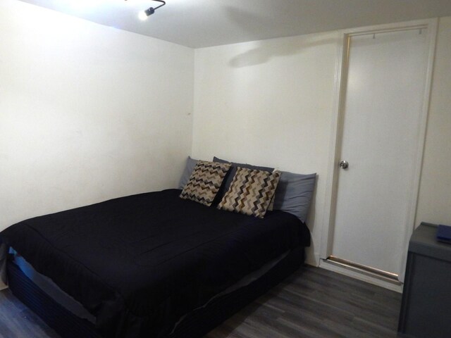 2406 Grape St, Joliet, IL 60435 - bedroom with dark wood-style floors