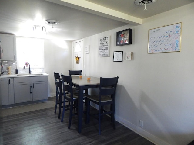 2406 Grape St, Joliet, IL 60435 - dining area with dark wood-type flooring and baseboards