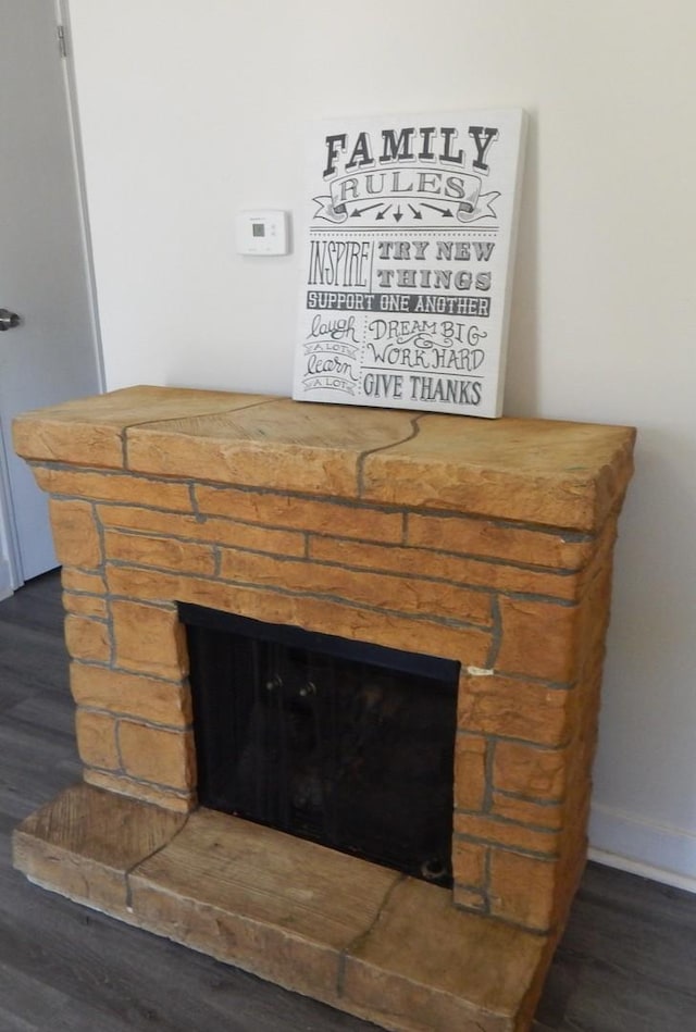 2406 Grape St, Joliet, IL 60435 - detailed view of a fireplace, wood finished floors, and baseboards