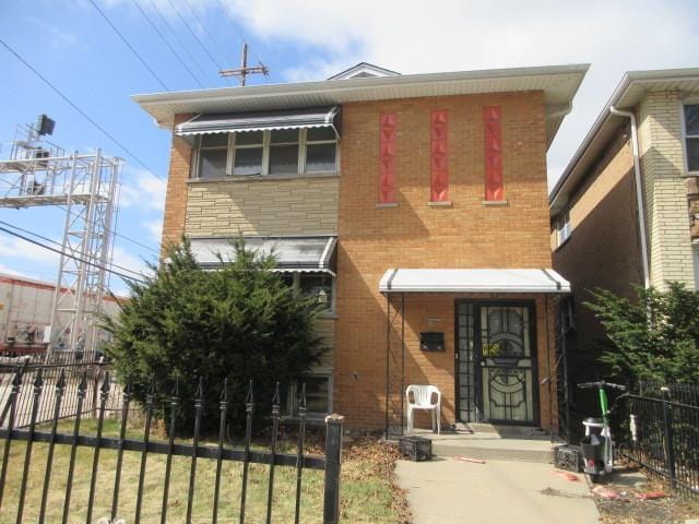 7448 S Maplewood Ave, Chicago, IL 60629 - view of front facade featuring brick siding