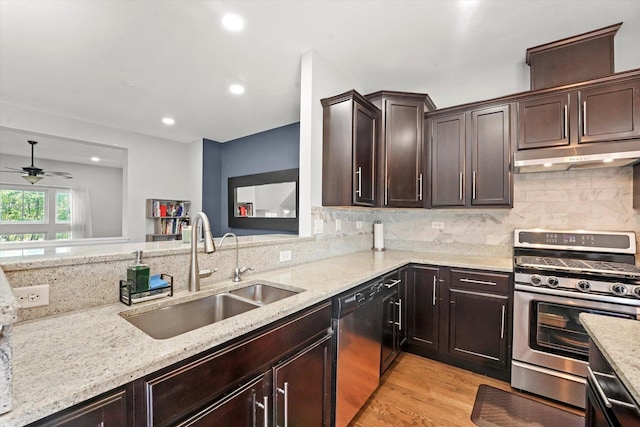 525 Plaza Pl, Aurora, IL 60504 - kitchen with appliances with stainless steel finishes, a sink, light stone countertops, under cabinet range hood, and a ceiling fan