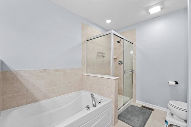 525 Plaza Pl, Aurora, IL 60504 - full bathroom with a bath, a shower stall, toilet, tile patterned flooring, and recessed lighting
