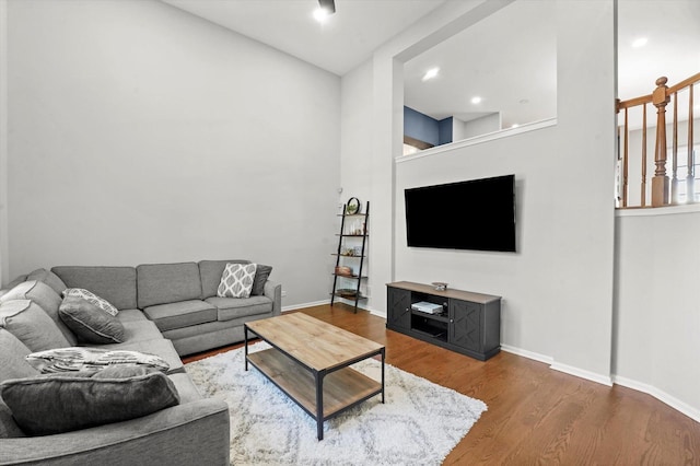 525 Plaza Pl, Aurora, IL 60504 - living area with wood finished floors, baseboards, a high ceiling, and recessed lighting