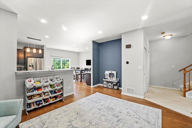 525 Plaza Pl, Aurora, IL 60504 - living area with stairs, recessed lighting, baseboards, and wood finished floors